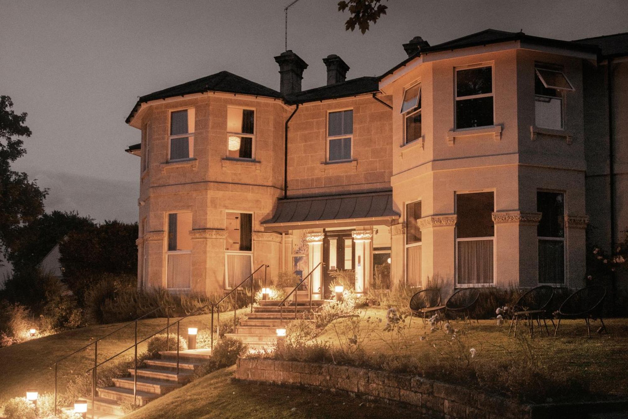 Leighton House - Boutique Guesthouse Bath Exterior photo The main house at night